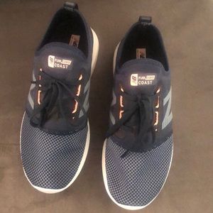 New Balance blue sneakers. Never been worn.